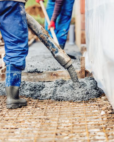 constuction-details-worker-laying-cement-or-concre-PUEFNWK constuction-details-worker-laying-cement-or-concre-PUEFNWK